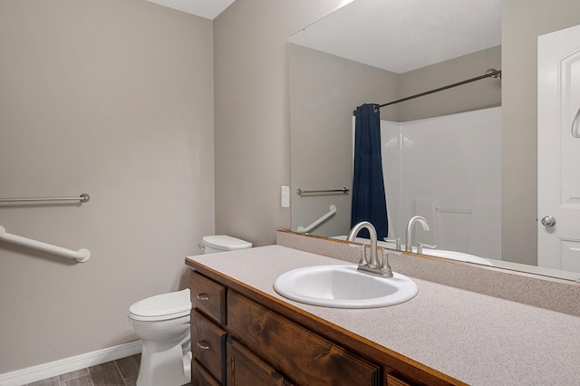 bathroom with vanity, toilet, and a shower with shower curtain