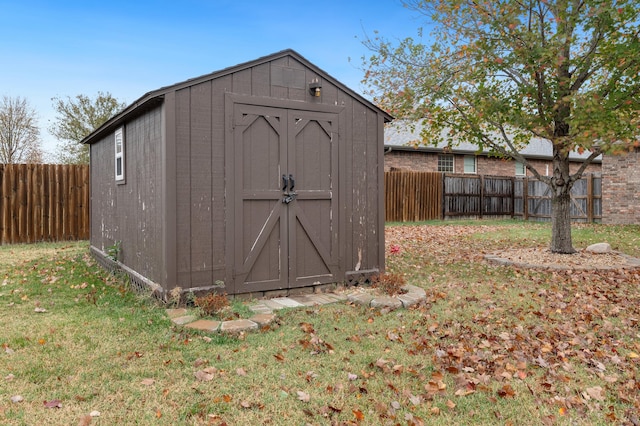 view of outbuilding with a yard