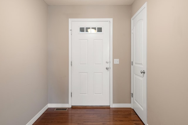 doorway to outside featuring dark hardwood / wood-style floors