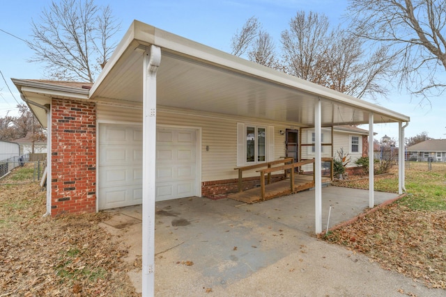 exterior space with a carport and a garage