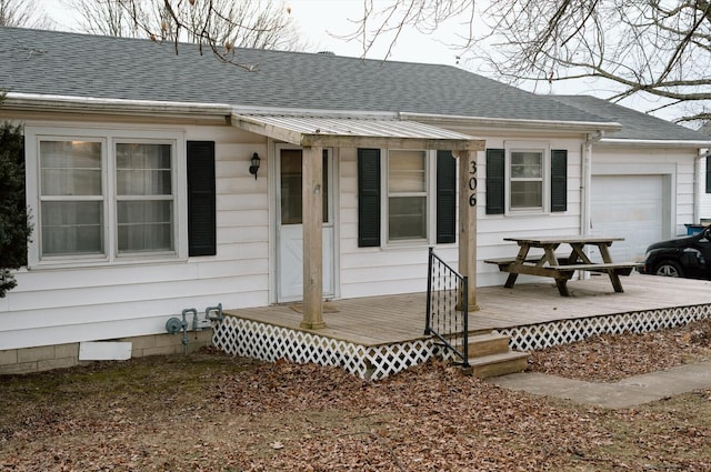 doorway to property with a garage