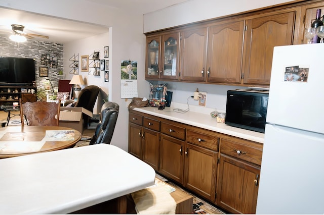 kitchen with ceiling fan and white refrigerator