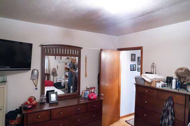 bedroom featuring a textured ceiling