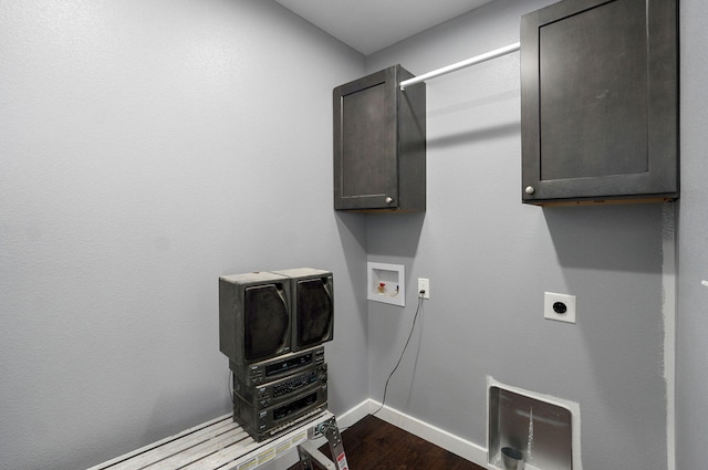 washroom with dark wood-type flooring, washer hookup, cabinet space, baseboards, and hookup for an electric dryer