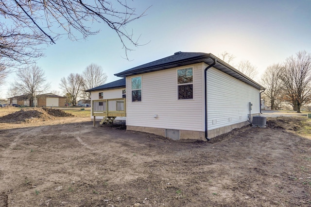 view of property exterior with central AC unit