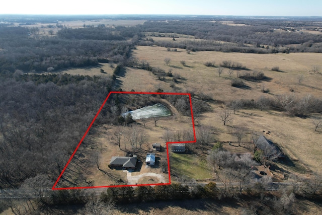 birds eye view of property featuring a rural view