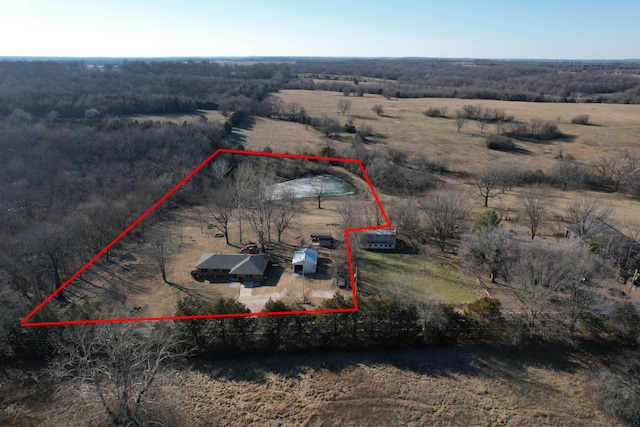 birds eye view of property with a rural view