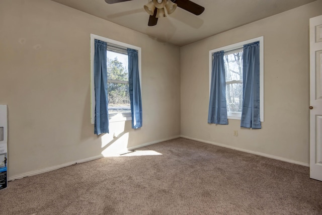 carpeted empty room with a healthy amount of sunlight