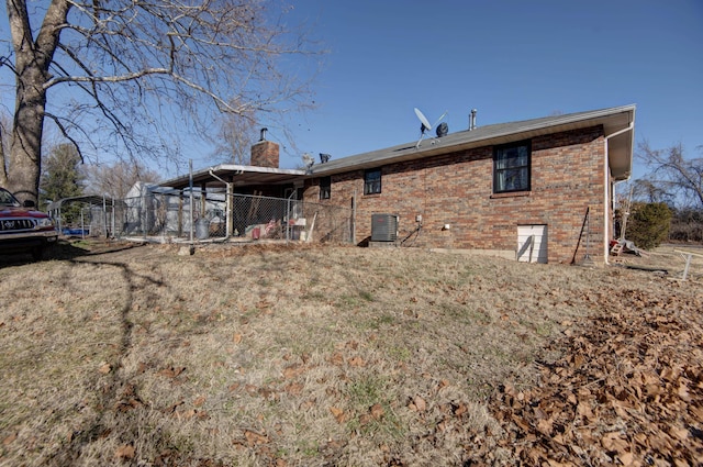 back of property featuring central AC unit