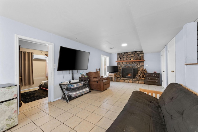 tiled living room featuring a stone fireplace