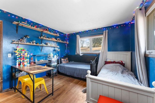 bedroom featuring wood-type flooring