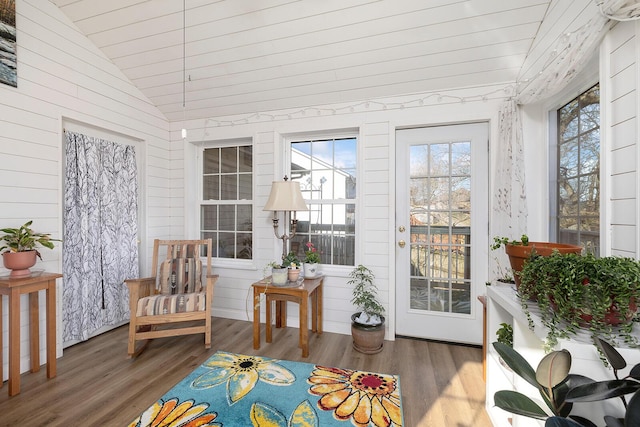 sunroom featuring lofted ceiling