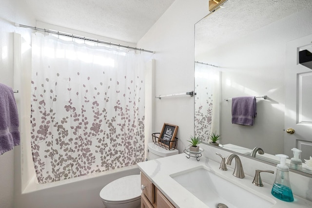 full bathroom featuring vanity, shower / tub combo with curtain, a textured ceiling, and toilet