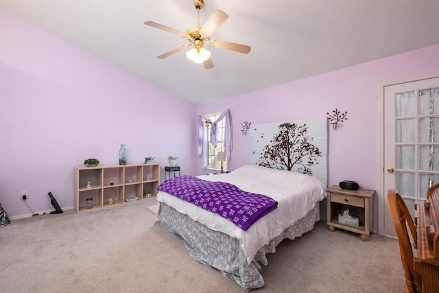 bedroom featuring ceiling fan, carpet flooring, and vaulted ceiling