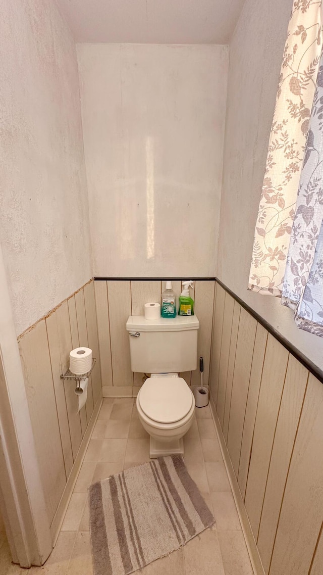 bathroom featuring tile patterned floors and toilet