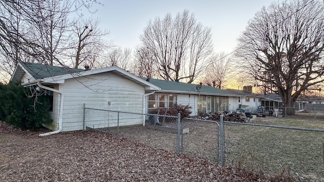 view of back house at dusk