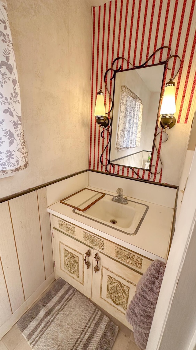 bathroom featuring tile patterned floors and vanity