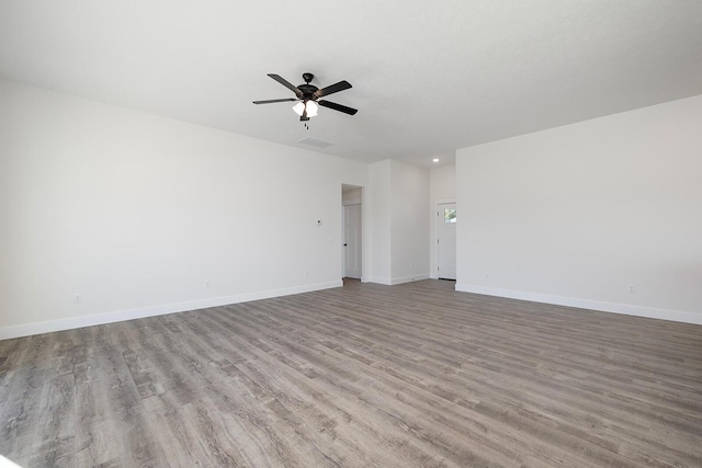 unfurnished living room featuring ceiling fan and light hardwood / wood-style flooring