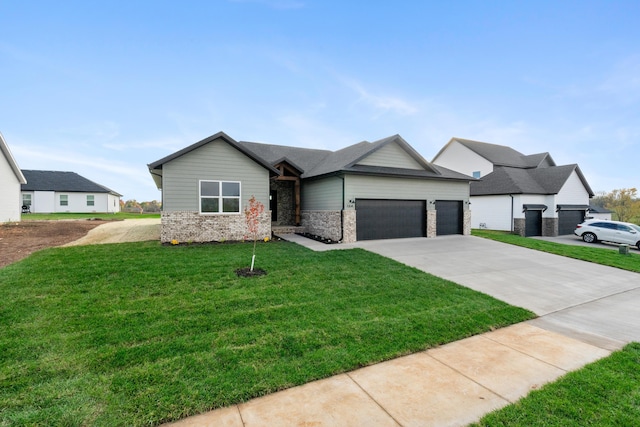 view of front facade with a garage and a front yard