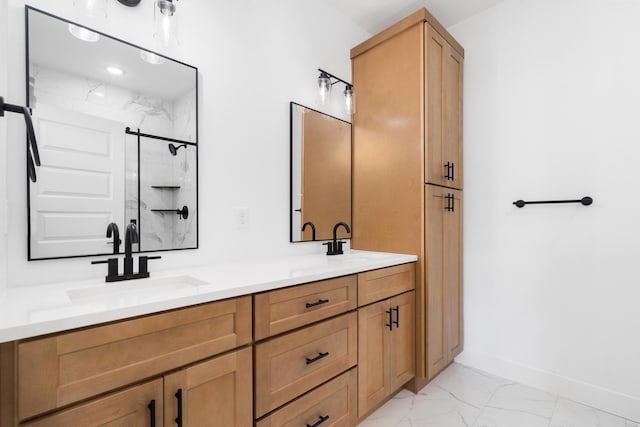 bathroom with vanity and a shower with shower door