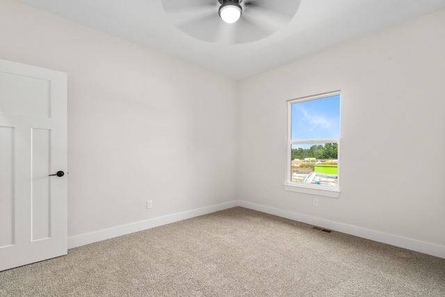 unfurnished room with ceiling fan and carpet floors