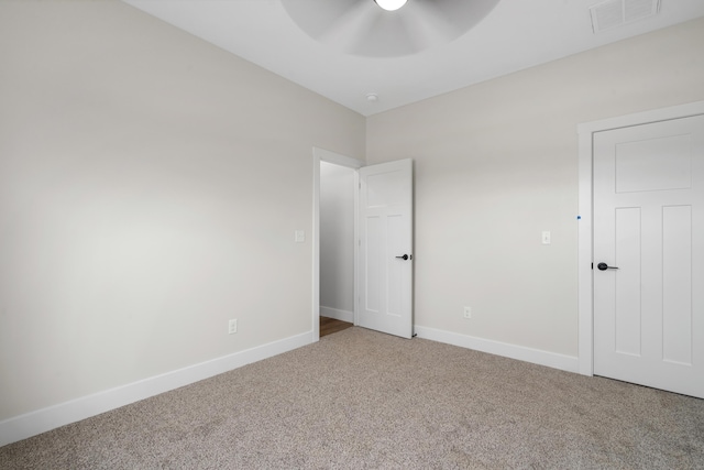 unfurnished bedroom featuring carpet flooring and ceiling fan