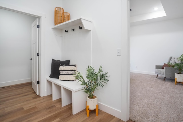 mudroom with wood finished floors, recessed lighting, baseboards, and visible vents