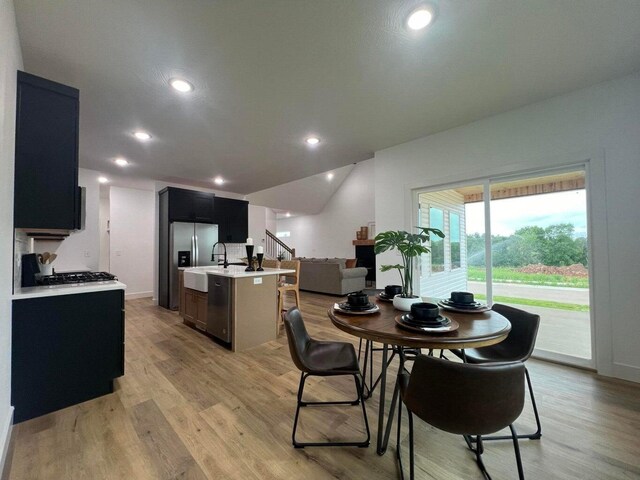 dining area featuring light wood-type flooring
