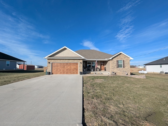 ranch-style home featuring a garage, a front lawn, and a porch