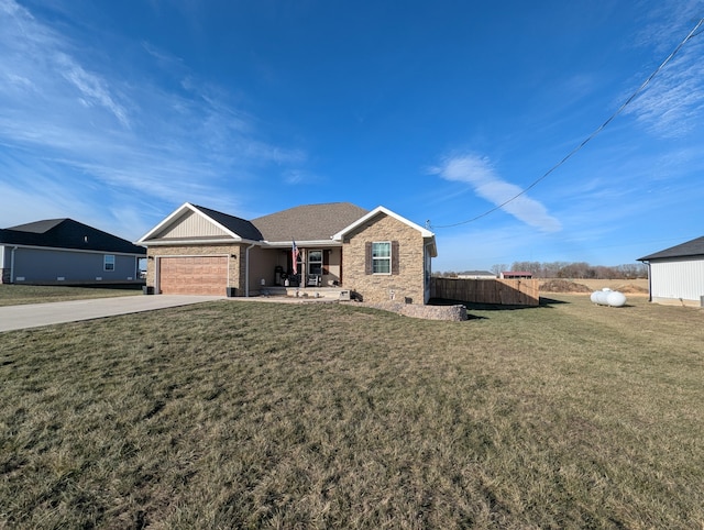 ranch-style house with a garage and a front yard