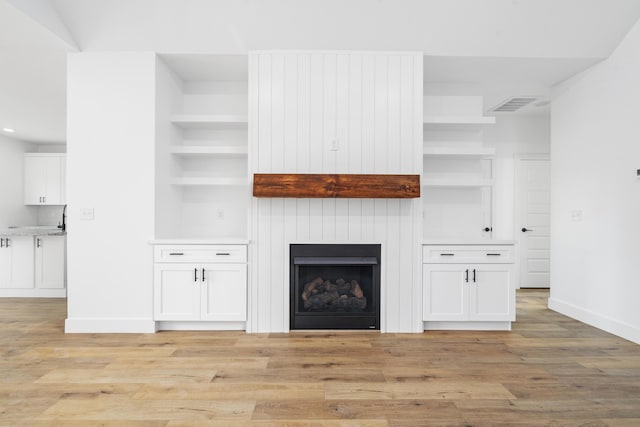 unfurnished living room with light hardwood / wood-style floors