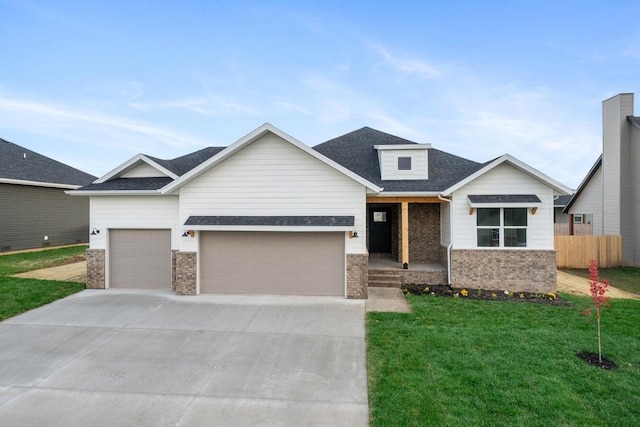 view of front facade featuring a garage and a front yard