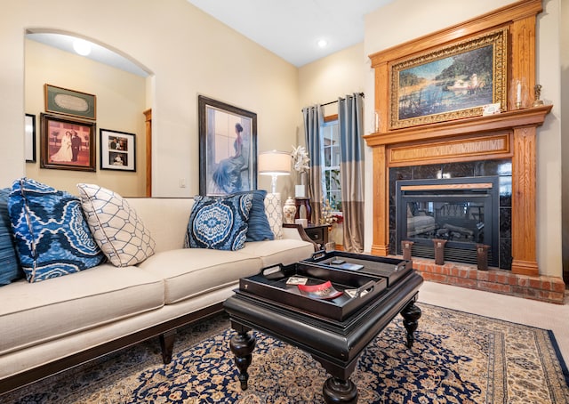 living room with a brick fireplace