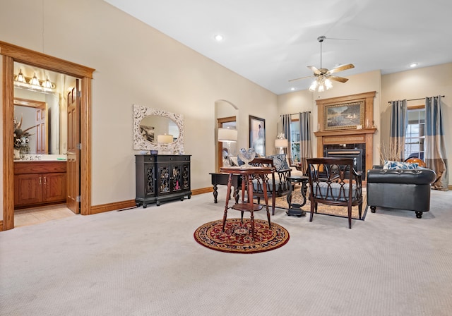 dining room featuring ceiling fan and light carpet