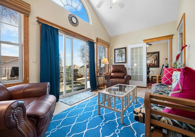 living room with high vaulted ceiling, french doors, and ceiling fan