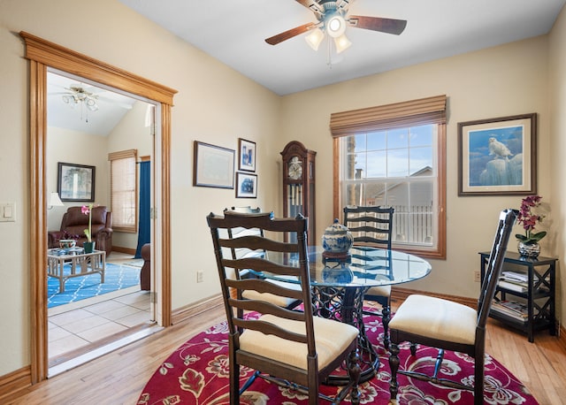 dining space featuring ceiling fan and light wood-type flooring