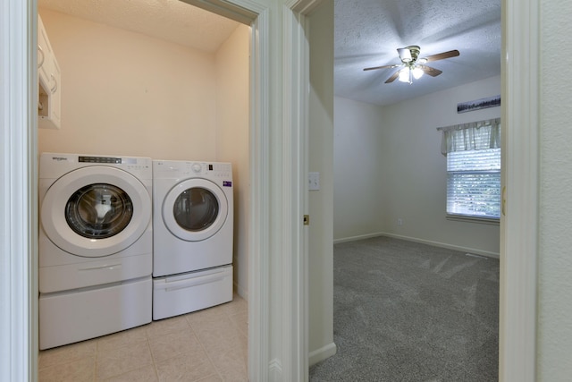 laundry area featuring ceiling fan, independent washer and dryer, light colored carpet, and a textured ceiling