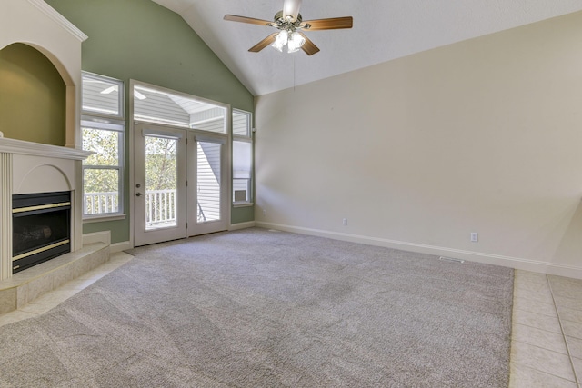 unfurnished living room with lofted ceiling, light carpet, and ceiling fan