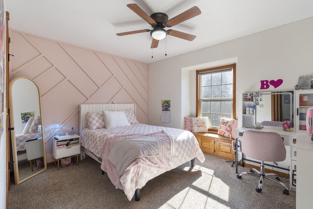 carpeted bedroom with wooden walls and ceiling fan