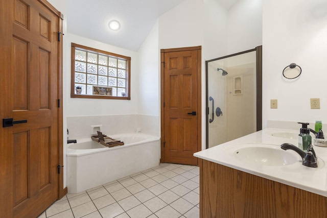 bathroom with tile patterned flooring, vanity, lofted ceiling, and independent shower and bath