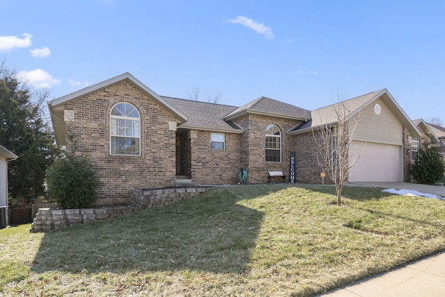 single story home with a garage and a front yard