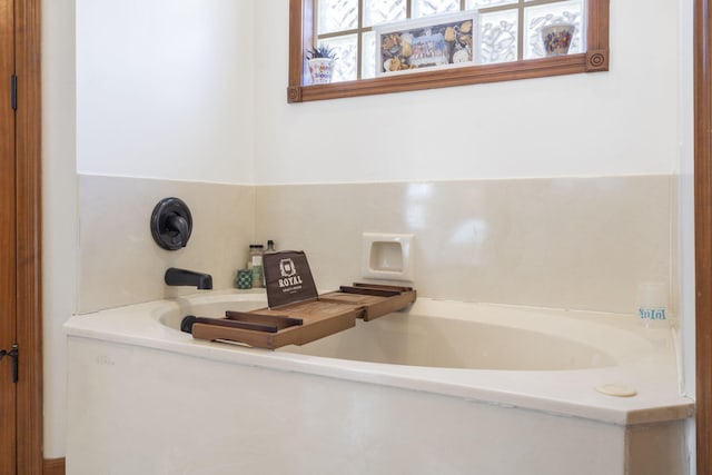 bathroom featuring a tub