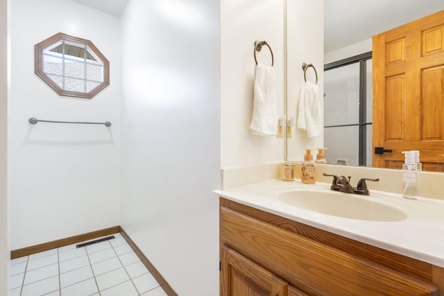 bathroom with tile patterned flooring and vanity