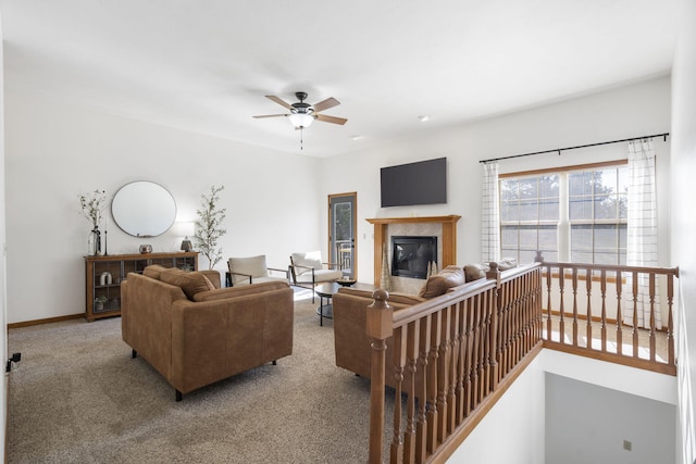 carpeted living room featuring ceiling fan