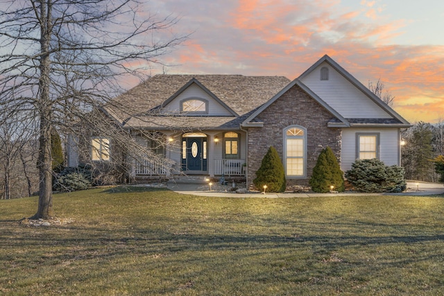 view of front of home featuring a lawn and a porch