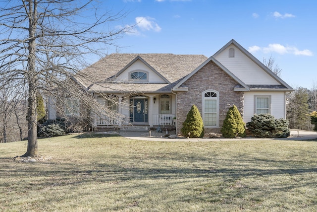 view of front of property featuring a front lawn and a porch