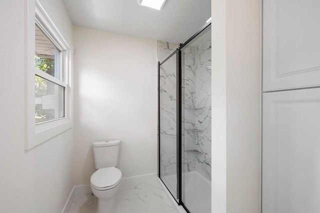 bathroom with toilet and a shower with shower door