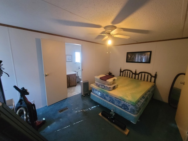 carpeted bedroom with ceiling fan, ornamental molding, radiator, and ensuite bath