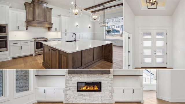 kitchen with sink, white cabinets, and appliances with stainless steel finishes