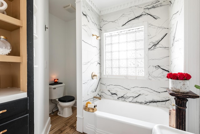 bathroom featuring built in shelves, wood-type flooring, and toilet